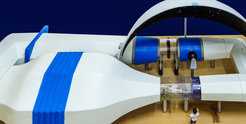 Model of a wind tunnel consisting of a ring of tubes of different sizes.